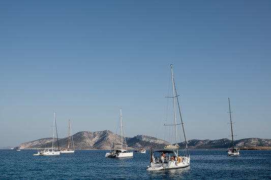 Sailing boats anchored in the Greek Islands available as Sailing fine art wall prints for your home or space.