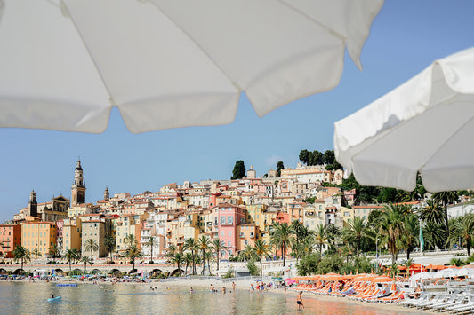 Looking through umbrellas to Menton on the French Riviera, available as French Riviera fine art wall prints.
