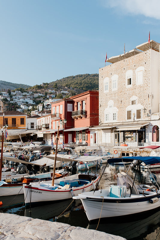 Framed photograph of a coastal scene with boats and colorful buildings. HYDRA ISLAND, GREECE SHOP Wall art prints from the celebrated Greek Island of Hydra. Fine Art Prints Hydra. Bring the classic feel of Greece into your home.