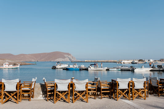Greek taverna art prints showcase seats of a cafe show typical Greek Island life on the island of Psara, an available as fine art photographic prints.