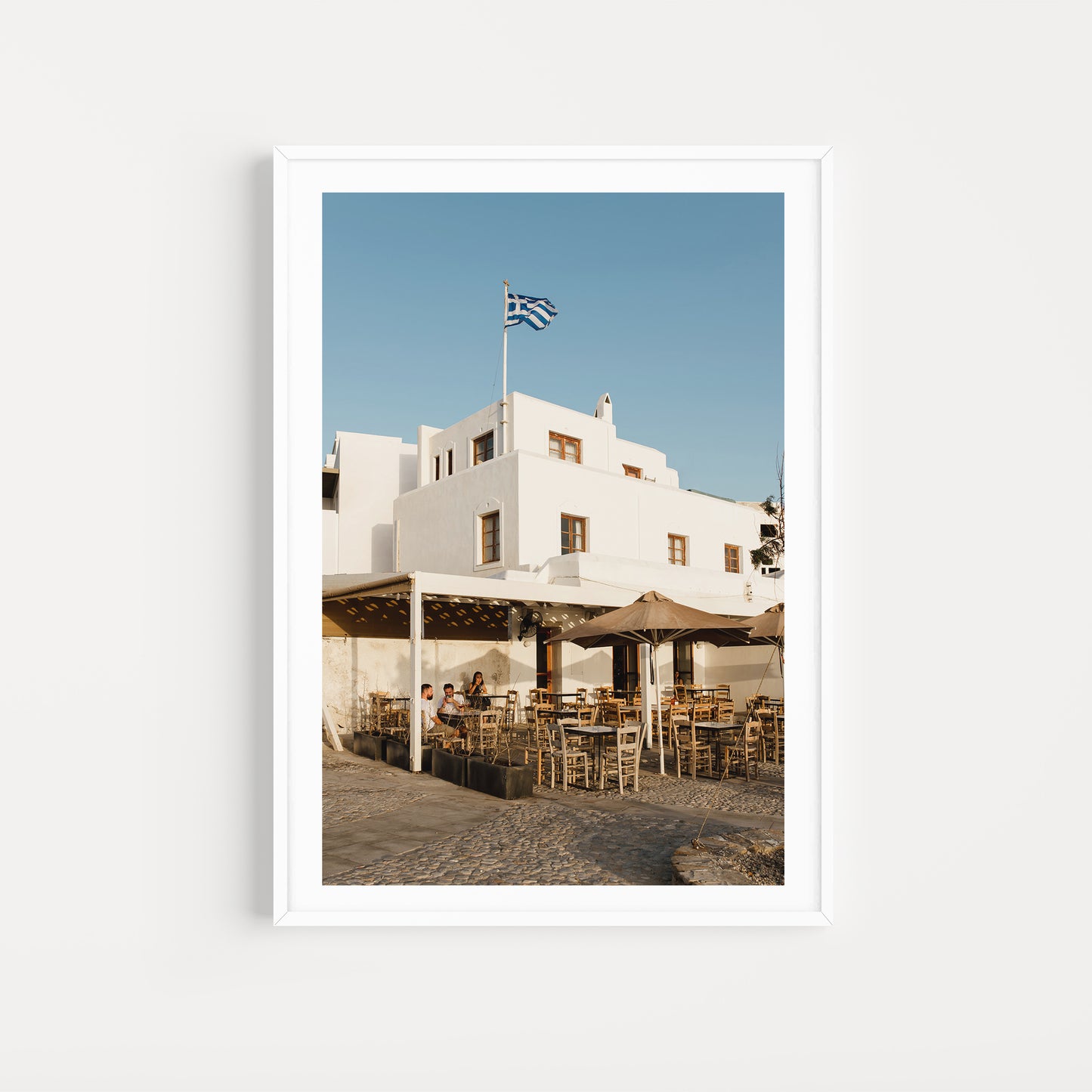 Naxos cafe at golden hour. Style your space with a diverse range of high-quality Greece fine art prints — exclusive from photographer Brooke Darling Studio. Greek Islands Art Prints.