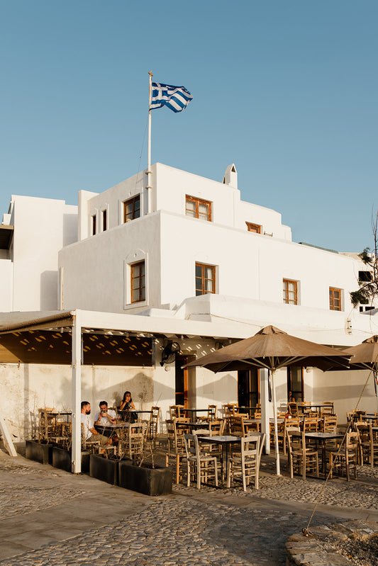 Naxos cafe at golden hour. Style your space with a diverse range of high-quality Greece fine art prints — exclusive from photographer Brooke Darling Studio. Greek Islands Art Prints.