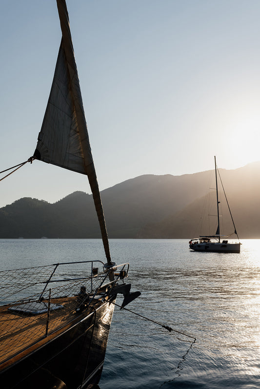 Bring the daydream of sailing into the sunset into your home with sailing boat fine art prints featuring a sunset moor approach at Dalyan, Türkiye. Sailing Art Prints.