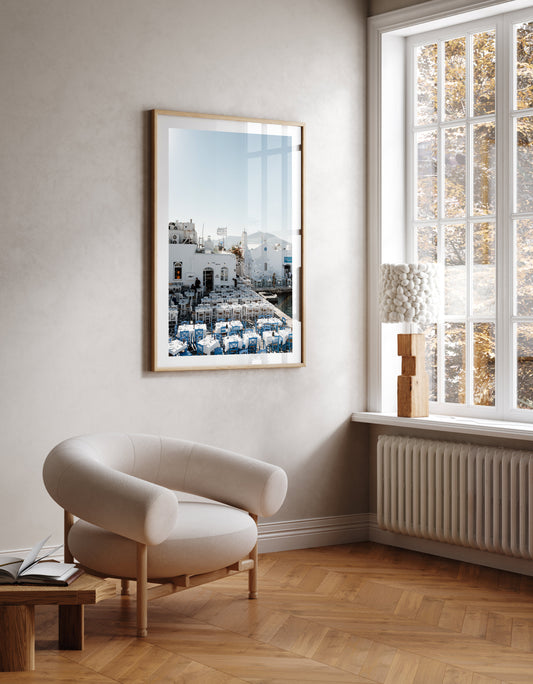 Room mock up of Greece Fine Art Photography Prints of an outdoor taverna on Naoussa boat harbour on the island of Paros. Portrait orientation. By Brooke Darling Photography.