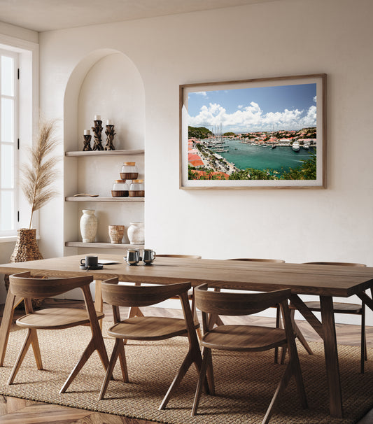Room mock up of framed fine art print of St Barts harbour in the Caribbean, with colourful rooftops and boats lined up. Saint Barths Island. Caribbean fine art prints.