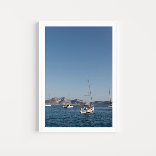 Sailing boats anchored in the Greek Islands available as Sailing fine art wall prints for your home or space.