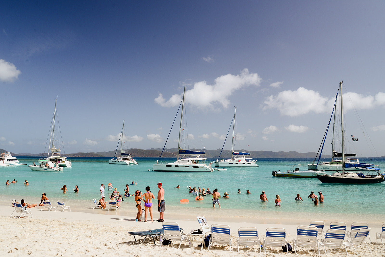 Beach scene with people, boats, and lounge chairs under a blue sky. JOST VAN DYKE, BRITISH VIRGIN ISLANDS, CARIBBEAN British Virgin Islands Wall Art Print Fine art travel prints are custom printed and framed to order.