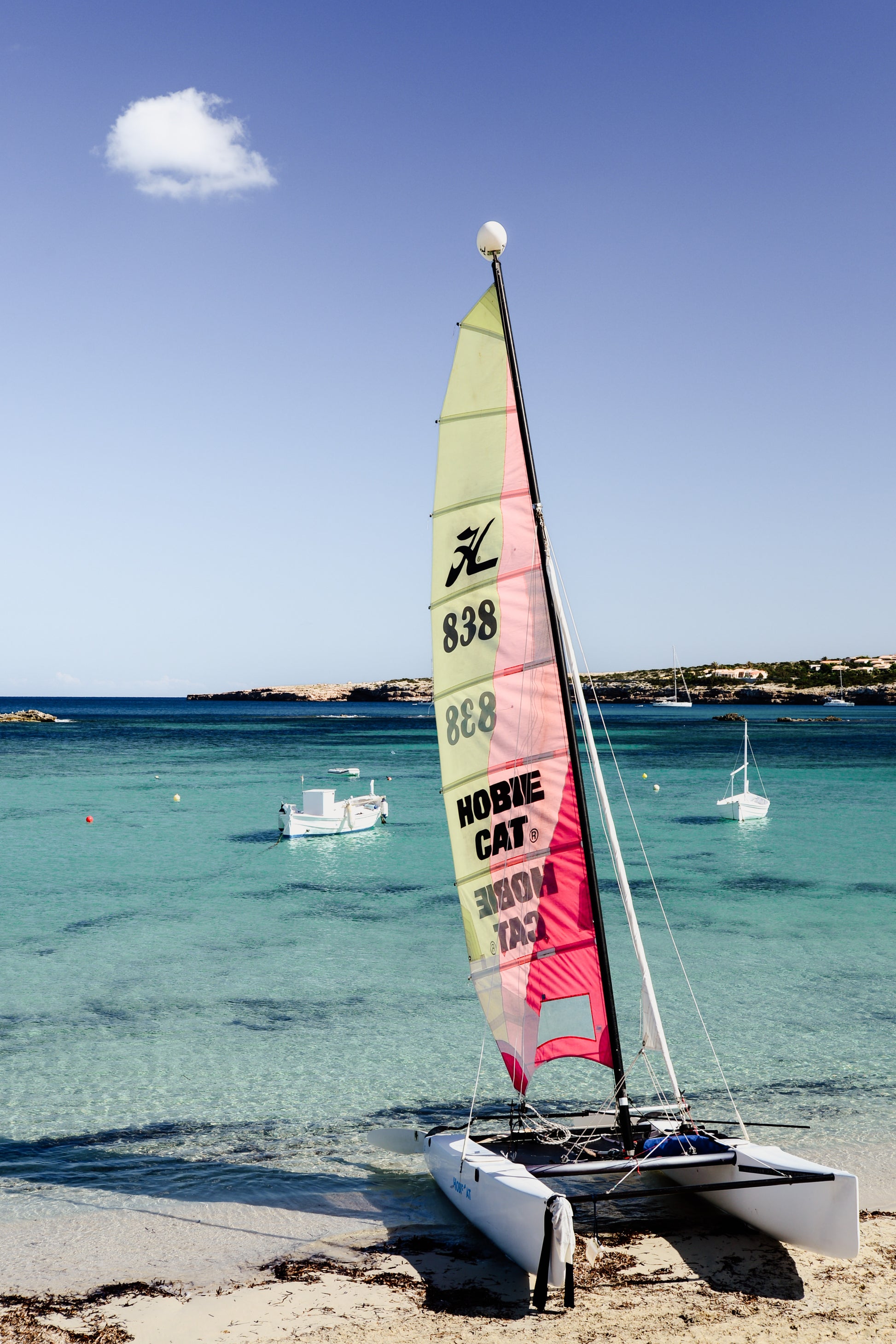 Hobby cat on the beach. Bring European Summer colour and energy into your home with Formentera Island scenes. Balearic Island Fine Art Prints. High-quality art prints, made to order.