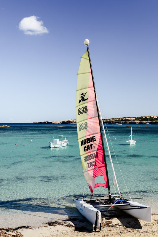 Hobby cat on the beach. Bring European Summer colour and energy into your home with Formentera Island scenes. Balearic Island Fine Art Prints. High-quality art prints, made to order.