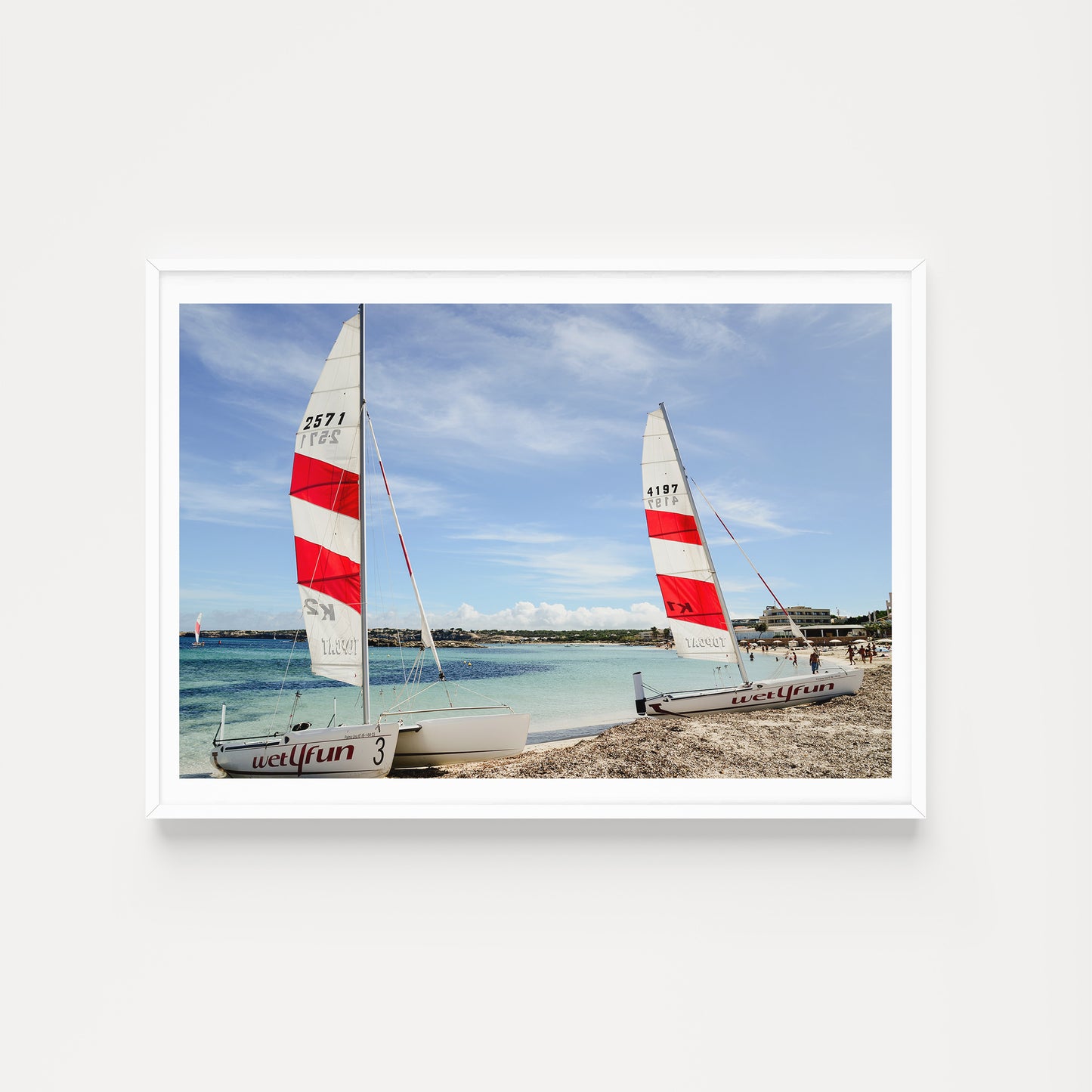 Framed photograph of two sailboats on a beach with a blue sky. SHOP FORMENTERA, BALEARIC ISLANDS, SPAIN | Balearic Islands Fine Art Prints. Bring the colour and life of summer in your home. Balearic Fine Art Prints. 
