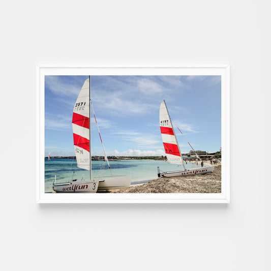 Framed photograph of two sailboats on a beach with a blue sky. SHOP FORMENTERA, BALEARIC ISLANDS, SPAIN | Balearic Islands Fine Art Prints. Bring the colour and life of summer in your home. Balearic Fine Art Prints. 