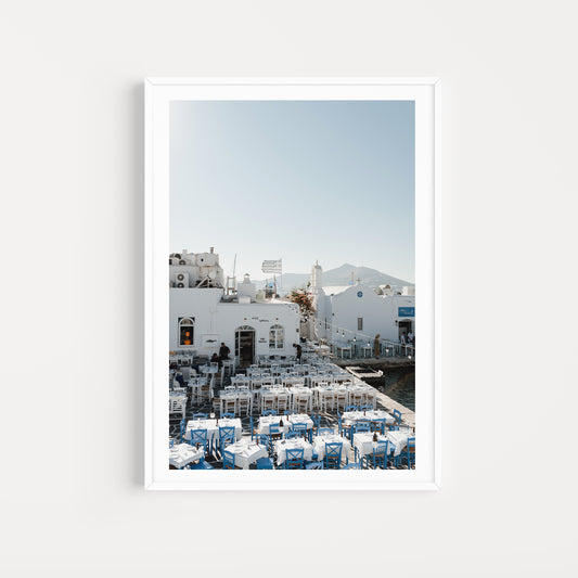 Greece Fine Art Photography Prints of an outdoor taverna on Naoussa boat harbour on the island of Paros. Portrait orientation. By Brooke Darling Photography.