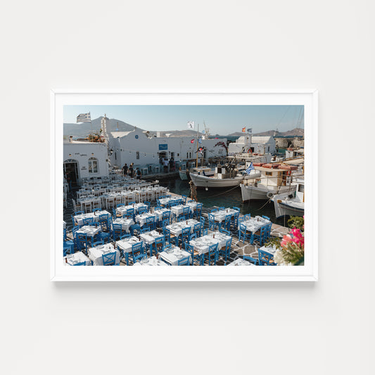 White frame mock up of Naoussa boat harbour with tavernas on the island of Paros, available as Greece fine art prints.