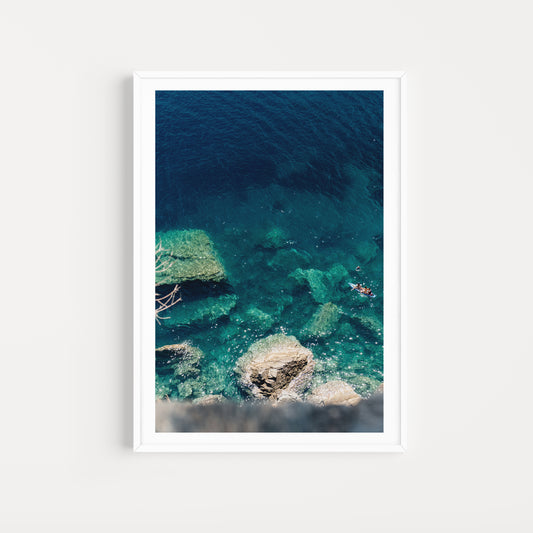 Framed artwork of a blue and green underwater scene with rocks. SKOPELOS, SPORADES, GREECE. Bring Mediterranean summer into your home. Greece Summer Fine Art Prints are custom printed and framed to order. 