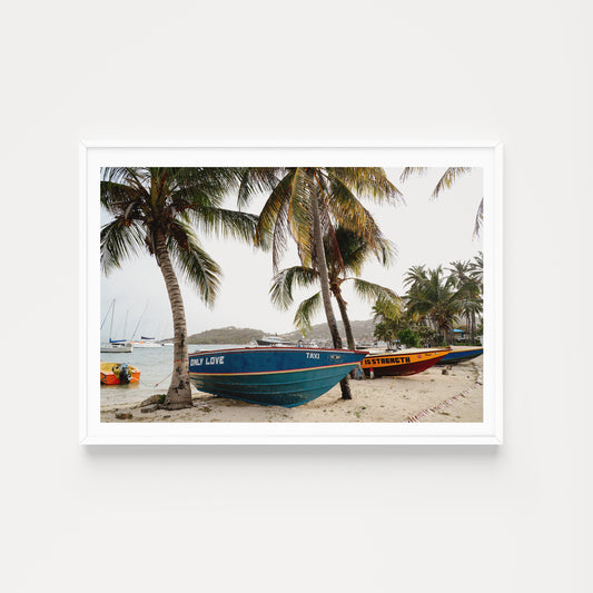 Framed photograph of boats on a beach with palm trees. SHOP Caribbean Wall Art Prints. Bring SAINT VINCENT AND THE GRENADINES, CARIBBEAN island life into your home. Caribbean Photographic Wall Art.