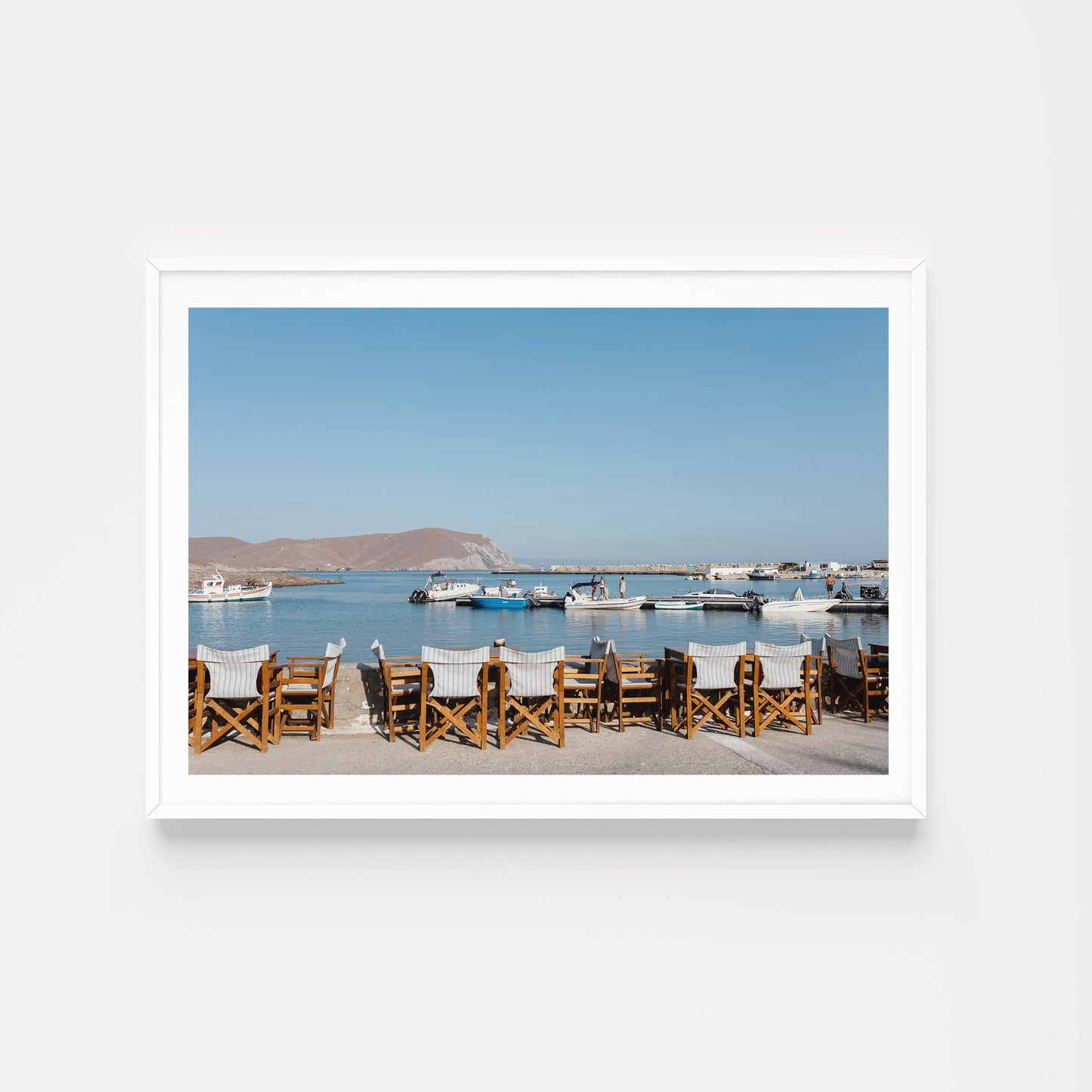 Greek taverna art prints showcase seats of a cafe show typical Greek Island life on the island of Psara, an available as fine art photographic prints.