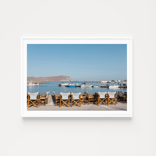 Greek taverna art prints showcase seats of a cafe show typical Greek Island life on the island of Psara, an available as fine art photographic prints.