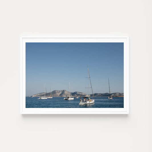 Sailing boats anchored in the Greek Islands available as Sailing fine art wall prints for your home or space.