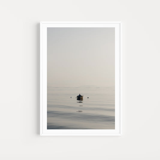 Framed artwork of a small boat on a calm body of water with a white frame. SHOP Mediterranean Wall Art Prints | Browse artfully captured and curated range of wall art and scenes from the Mediterranean. Mediterranean Fine Art Prints. 