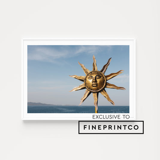 Greece Wall Art Print of Sun God and the Sea at Hydra Island, landscape format available for purchase. Showcasing dramatic Sun art installation. 