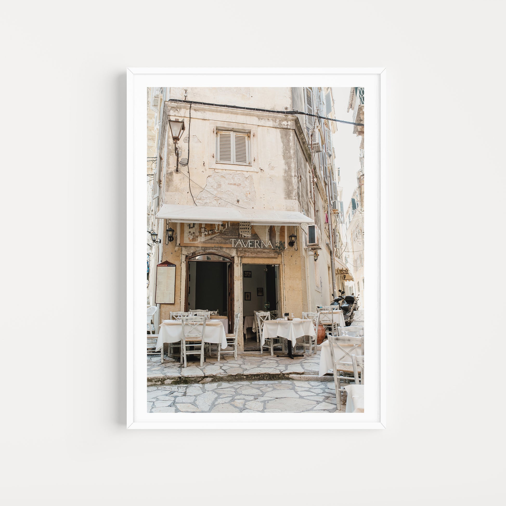 Framed photograph of a Taverna restaurant exterior with outdoor seating. CORFU OLD TOWN, IONIAN ISLANDS, GREECE. SHOP Greece Fine Art Photography Prints. With premium printing and framing, enjoy your investment for years to come.