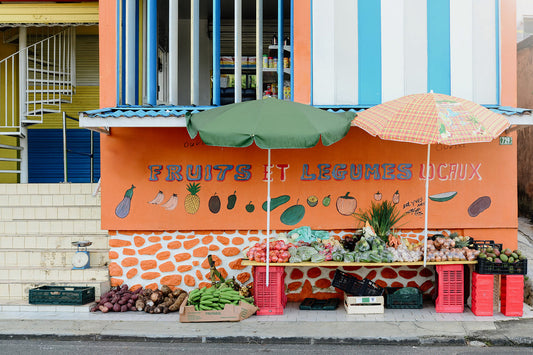 Colorful fruit stand with an orange canopy on a white background. Bring the colour and vibrancy of the Caribbean into your home with tropical framed wall art prints. Tropical Wall Art. Caribbean Fine Art Prints. 